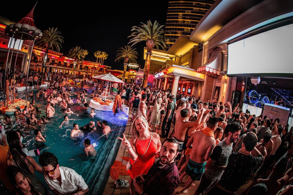 Group of friends dancing by the pool at an exclusive Las Vegas nightclub with party bus las vegas VIP experience