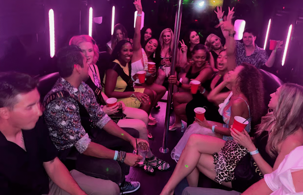 Adult party-goers enjoying open bar service on luxury party bus for las vegas nightlife adventure