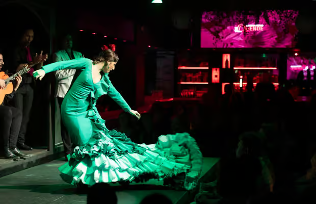 Passionate flamenco dancer on stage at intimate La Rambla venue during evening performance