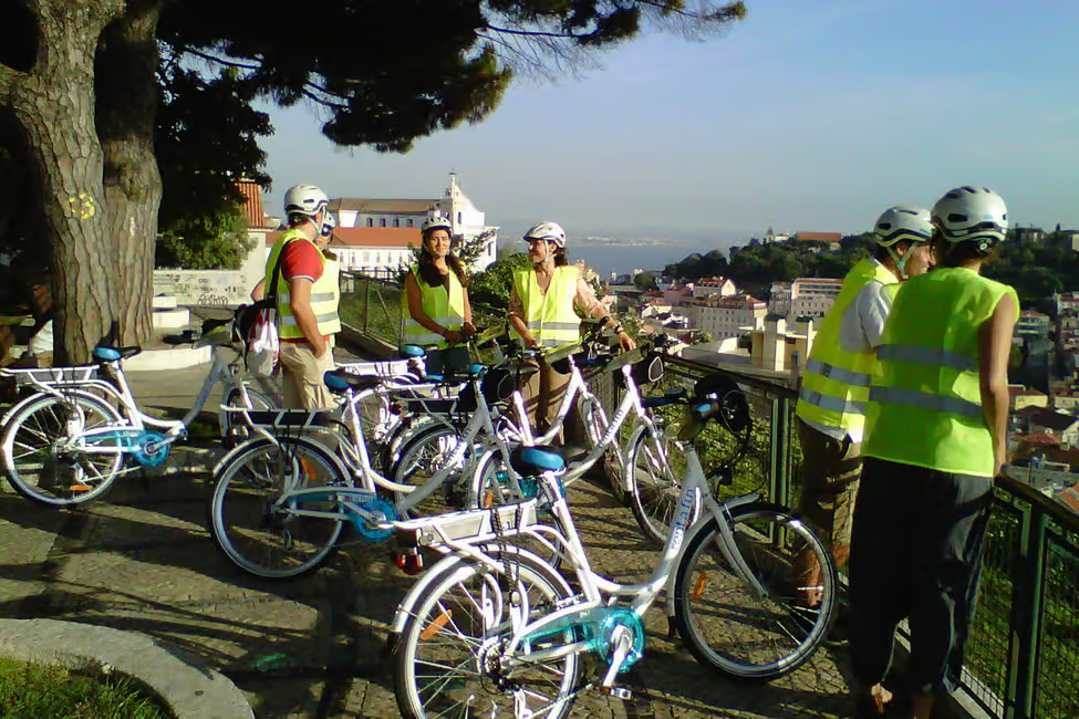 Tour group conquering Lisbon's seven hills on premium electric bikes with panoramic city views