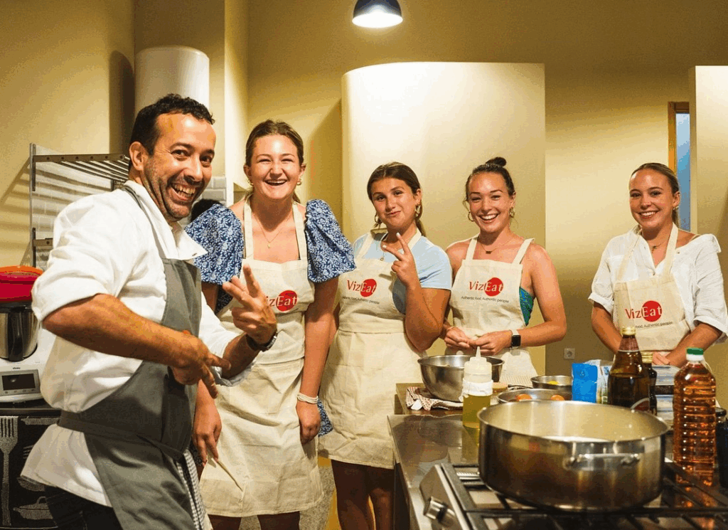 Intimate cooking session in local Portuguese home with small group learning authentic family recipes in Lisbon