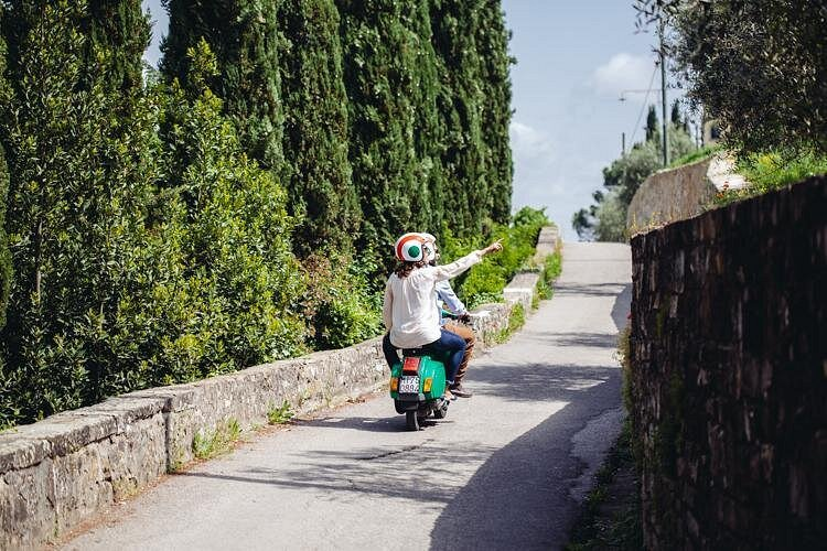 Small group on vespa tours Florence stopping at Piazzale Michelangelo for morning city skyline views