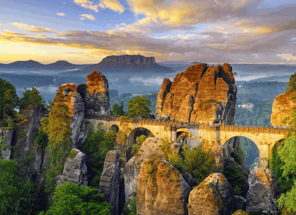 Day trips from Prague to the Bastei Bridge in Saxon Switzerland, featuring dramatic sandstone rock formations and forested valleys