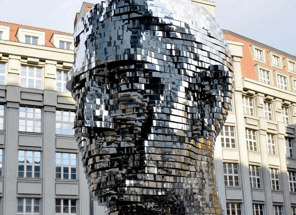 Prague Jewish Quarter walking tour featuring the rotating Franz Kafka head sculpture by David Černý near the Jewish Quarter in Prague