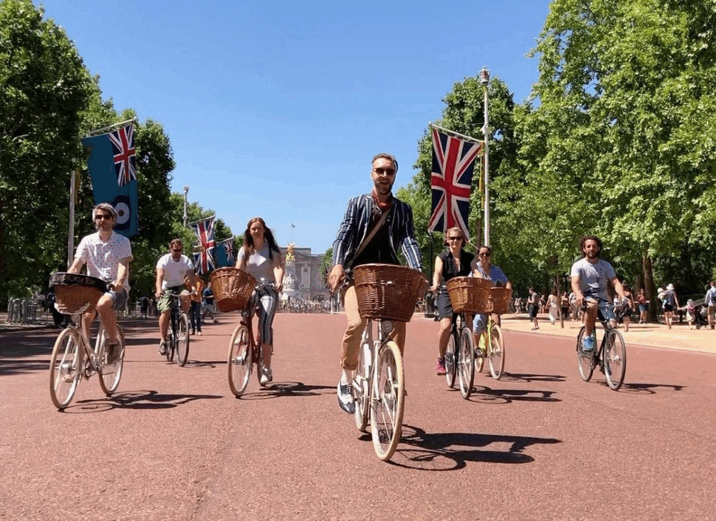 City bike tours in London featuring cyclists riding through central districts and riverside paths