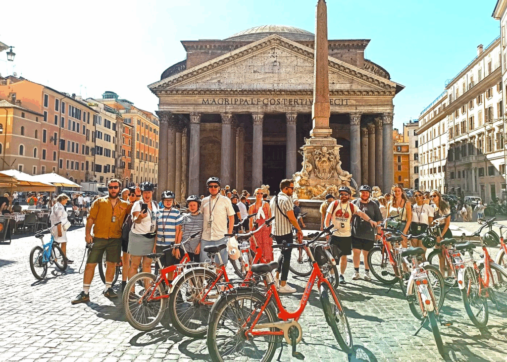 City bike tours in Rome featuring cyclists riding past ancient landmarks and historic neighborhoods