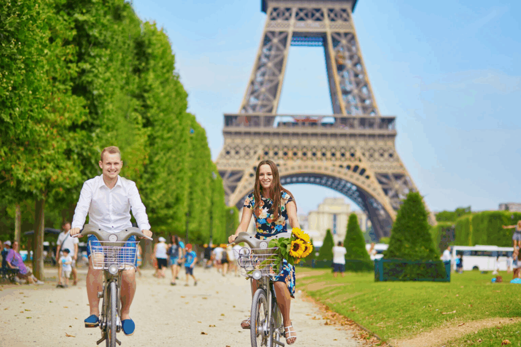 City bike tours in Paris showing cyclists riding along the Seine River and historic city streets