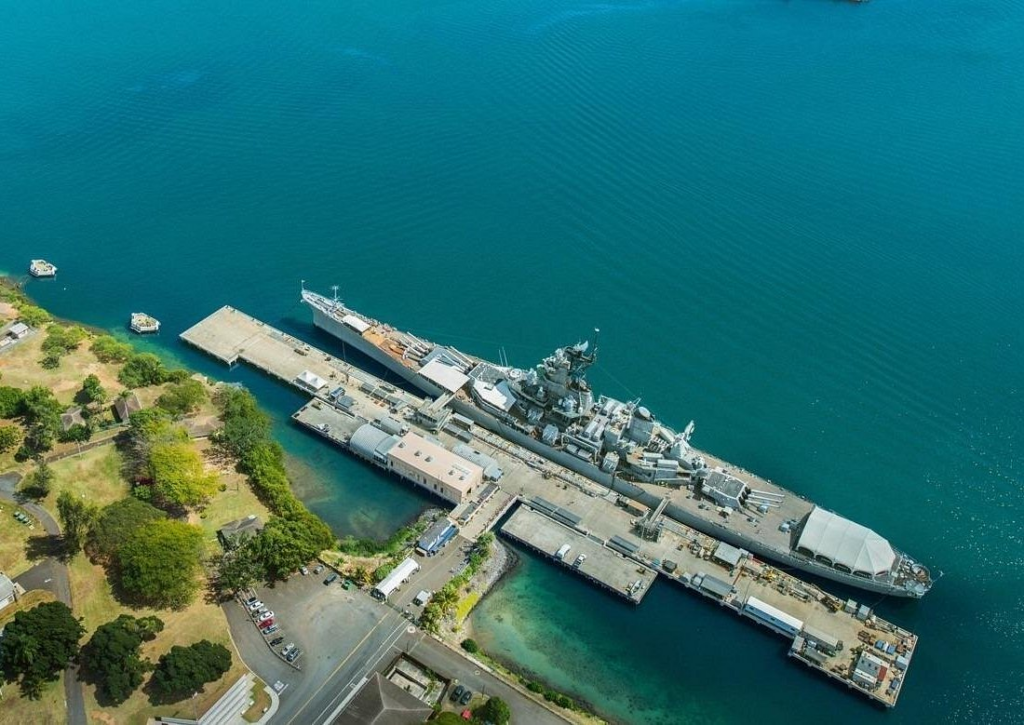Aerial view of the USS Missouri battleship docked at Pearl Harbor, a historic landmark commonly visited on pearl harbor tours in Honolulu, Hawaii.